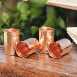 Set of four hand hammered copper tumblers